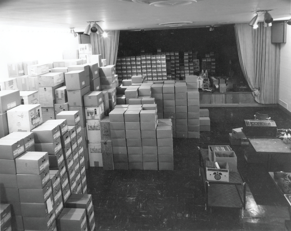 The Girard Foundation Folk Art Collection awaits processing in the auditorium at the Museum of International Folk Art, September 8, 1978. Photograph by Art Taylor. Multiple Visions: A Common Bond, MOIFA Exhibitions (AR00004.170), Bartlett Library and Archives, Museum of International Folk Art.