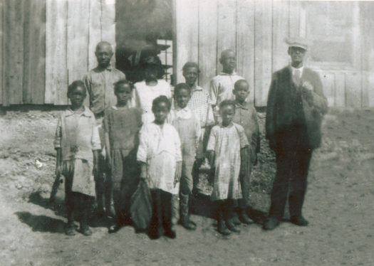 Blackdom School, Blackdom, New Mexico, ca. 1920s. Teacher Loney K. Wagoner (far right).