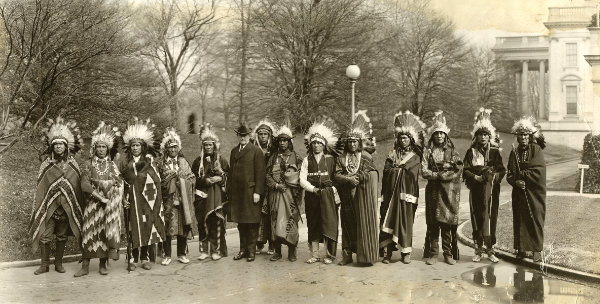 New Mexico delegation in Washington DC, protesting the Bursum Bill, President Calvin Coolidge in center, ca. 1923-1924. Includes Pueblo governors and members of the All-Pueblo Council including Juan Avila (Sandia), Santiago Naranjo (Santa Clara), Martin Vigil (Tesuque), Sotero Ortiz (San Juan), Jose Alcario Montoya (Cochiti), and others. Photograph by Schutz. Courtesy Palace of the Governors Photo Archives (NMHM/DCA), neg. no. 047827.