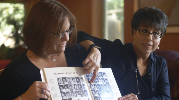 Stephanie Sanchez points to her sister Molly Chavez’s photo in the Valley
High School yearbook. Production still from The Whistle, 2019. Courtesy of
StormMiguel Florez.