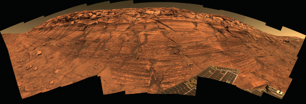 Layered sediments in the wall of Endurance Crater, Mars. Photograph courtesy NASA.