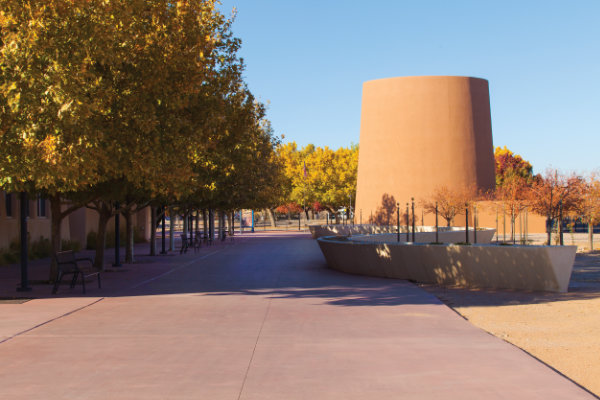 The Torreón and an acequia-inspired water feature pay tribute to traditional elements of New Mexican Hispanic life transplanted from Mexico and Spain. Photograph by Addison Doty.