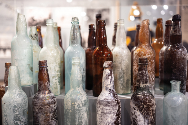 Glass from whiskey, beer, and medicine is some of the most common archaeological finds at Fort Selden Historic Site. Several have been recovered during surveys and are now on display in the Fort Selden Historic Site Visitor Center. Photograph by Tira Howard.