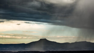 color landscape of rain in the foreground and light behind