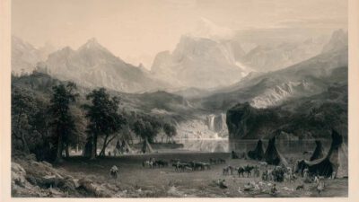 A group of tipis and people with horses in a grassy valley, bordered by trees, with tall mountains and a lake in the background. [gen-ai]