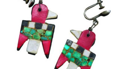 A pair of clip-on earrings shaped like birds, featuring red, white, black, and green inlaid stones arranged in a mosaic pattern. [gen-ai]