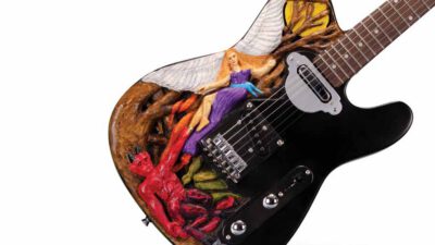 Electric guitar with custom artwork depicting a winged woman in a purple dress and a red devil-like figure on the body near the bridge and pickups. [gen-ai]