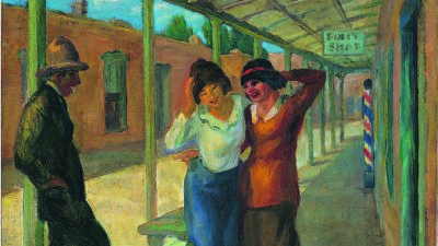 Three people interact on a covered sidewalk near a barber shop; two women stand close together while a man leans nearby, watching them. [gen-ai]