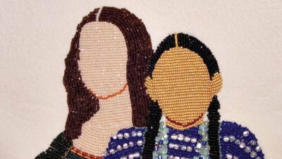 Beaded artwork of two faceless figures, one with long brown hair and one with black braids, both wearing detailed blue and purple clothing, on a plain light background. [gen-ai]