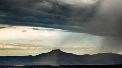 color landscape of rain in the foreground and light behind
