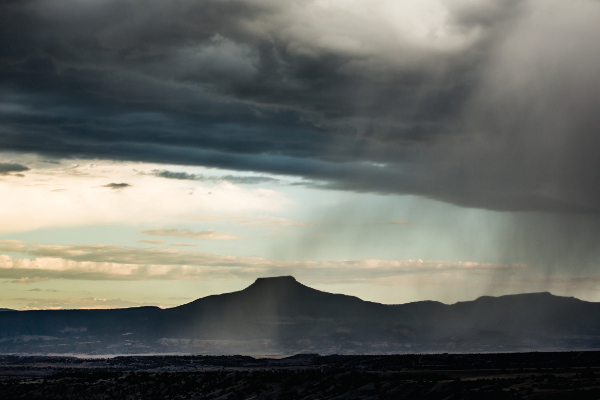 color landscape of rain in the foreground and light behind