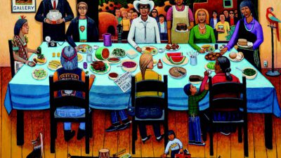 A diverse group of people gather around a table filled with food, set indoors with mountains visible through an open doorway; various cultural elements are present. [gen-ai]