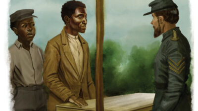 Two men stand at a wooden table outdoors, speaking to a uniformed officer; trees and sky are visible in the background.